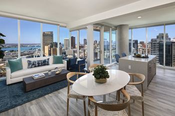 A modern living room with a view of the city skyline.